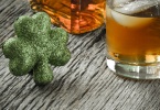 Glass of Whiskey and Clovers to celebrate St Patrick's Day