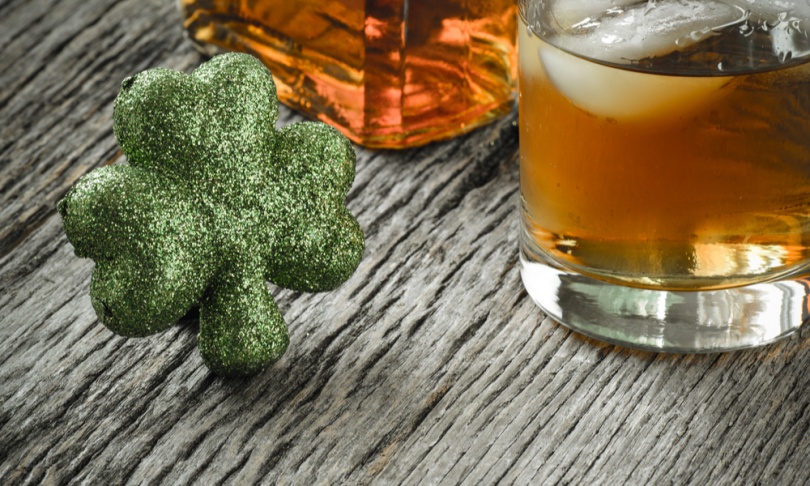 Glass of Whiskey and Clovers to celebrate St Patrick's Day