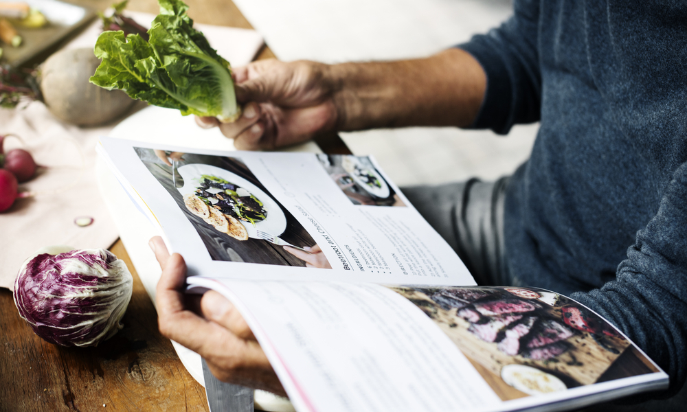 person reading cooking book