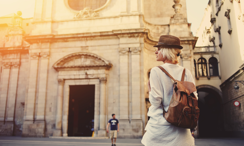 Solo trip ideas for valentine's day: view of a young female wanderer out sightseeing in a foreign city