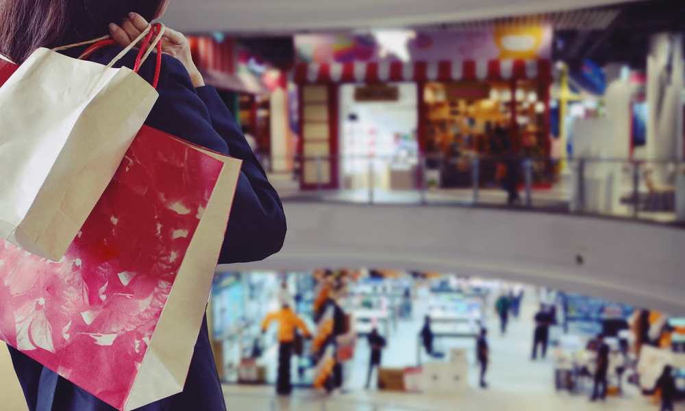 Woman holding shopping bags in the shopping mall