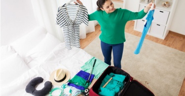 woman-sorting-out-her-packing