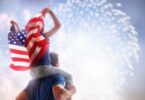 Father and son waving American flag