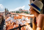 Young female tourist enjoying great view on the old town of Prague