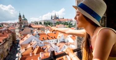 Young female tourist enjoying great view on the old town of Prague