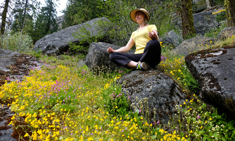 Young woman meditating in nature