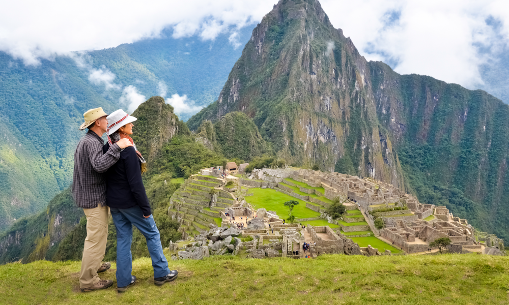 a couple standing at the top of Machu-Picchu