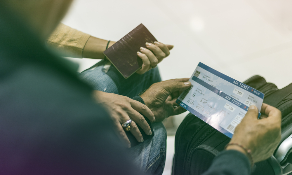 Married couple with passport and boarding pass