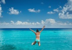 girl-jumping-into-ocean