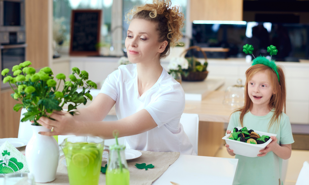 Mother with child make preparations for Saint Patrick's Day