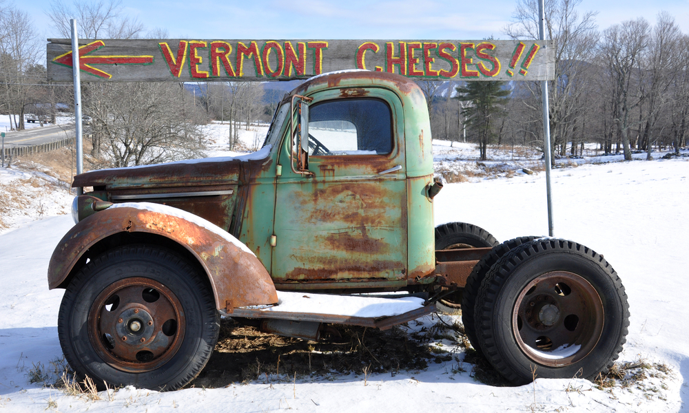 Vintage Vermont cheese sign with rusty antique truck.