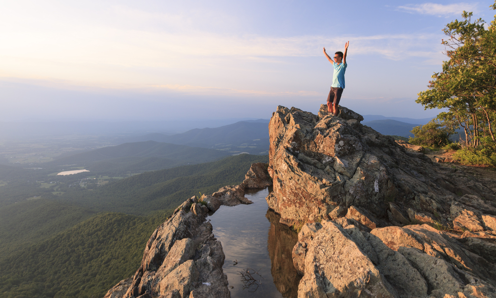 man atop a hill at shenandoah-national-park