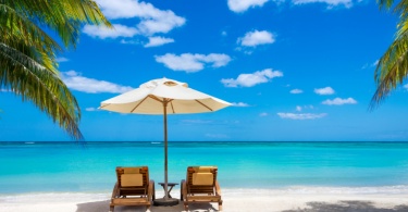 turquoise sea, deckchairs, white sand and palms, sun, very beautiful nature