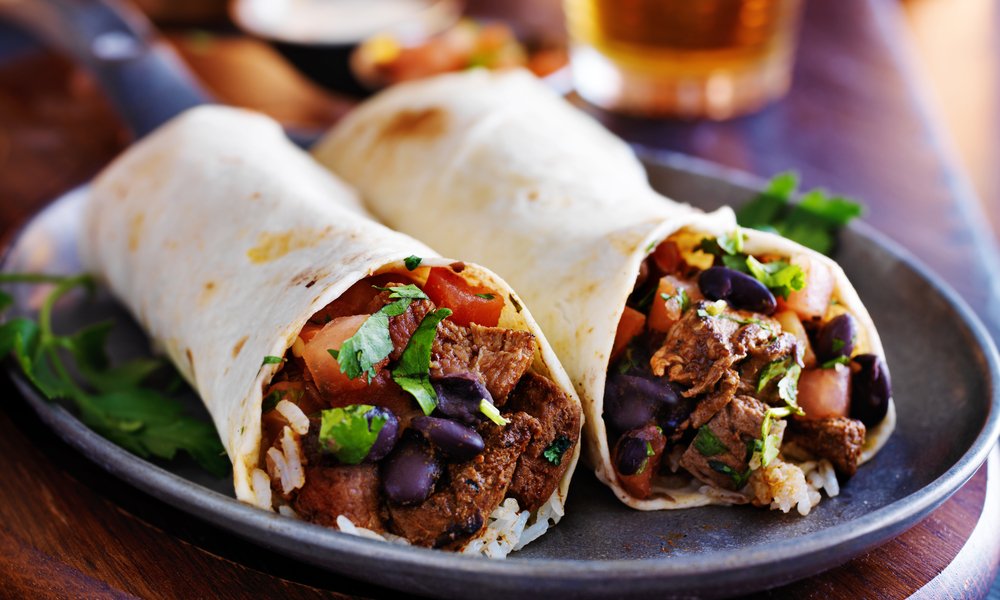 two beef burritos with rice, black beans and salsa