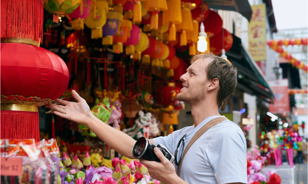 man shopping at a street market