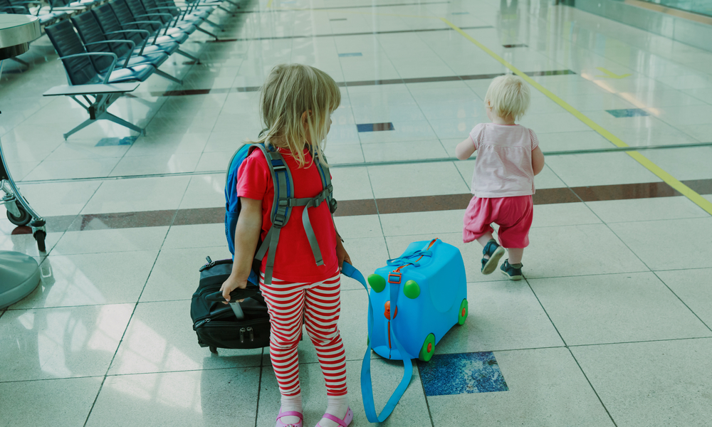 children with bags in airport