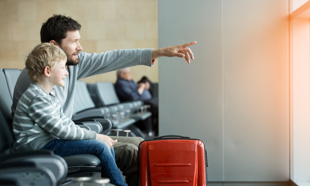 family waiting in boarding gate before flight