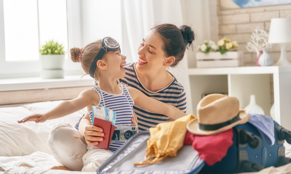 mother and daughter packing for a trip