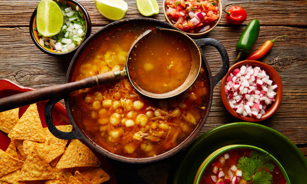 Pozole with mote big corn stew from Mexico with ingredients and appetizer