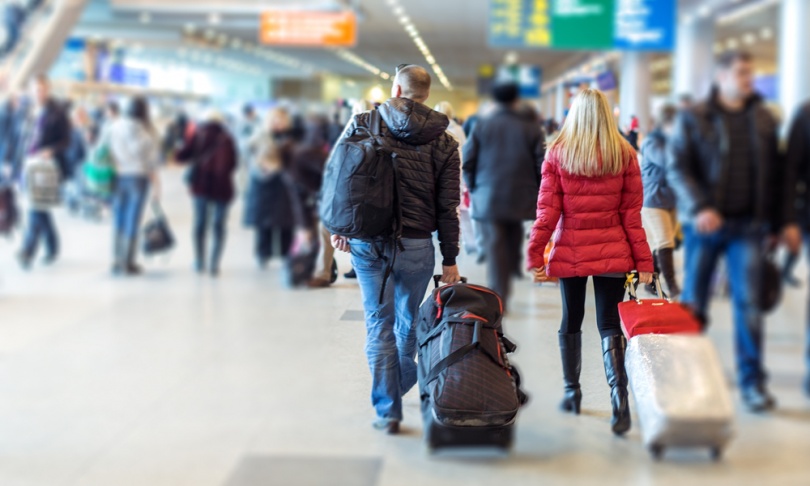 couple walking in an airport