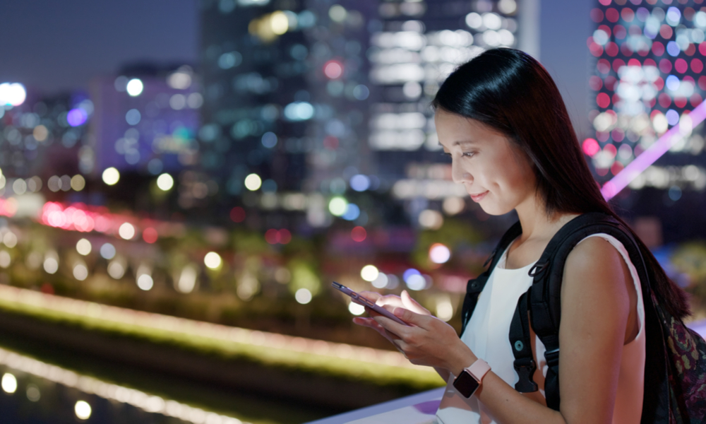 woman looking at cell phone