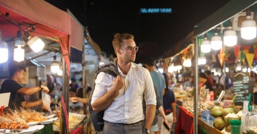 man walks through chinatown