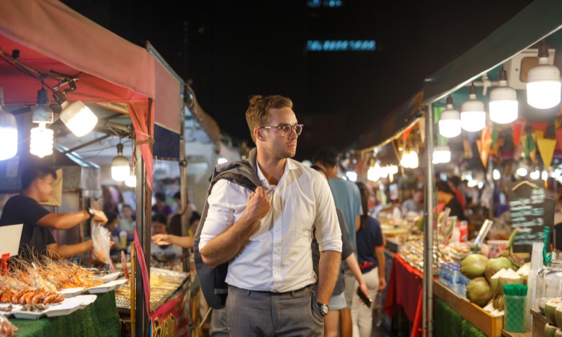 man walks through chinatown