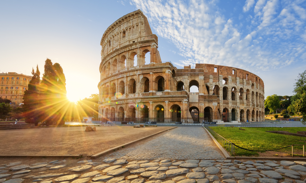 View of Colosseum in Rome and morning sun, Italy, Europe. 