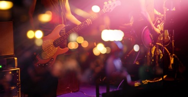 Guitarist on stage for background, soft and blur concept