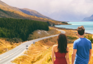 couple by a road in new zealand