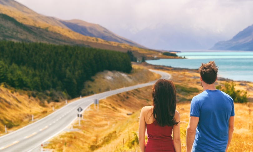 couple by a road in new zealand