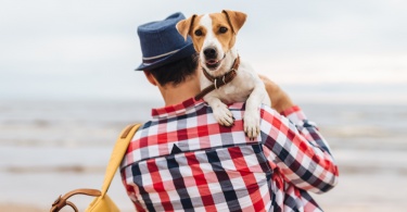 man holding dog