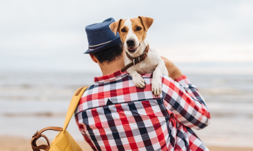 man holding dog