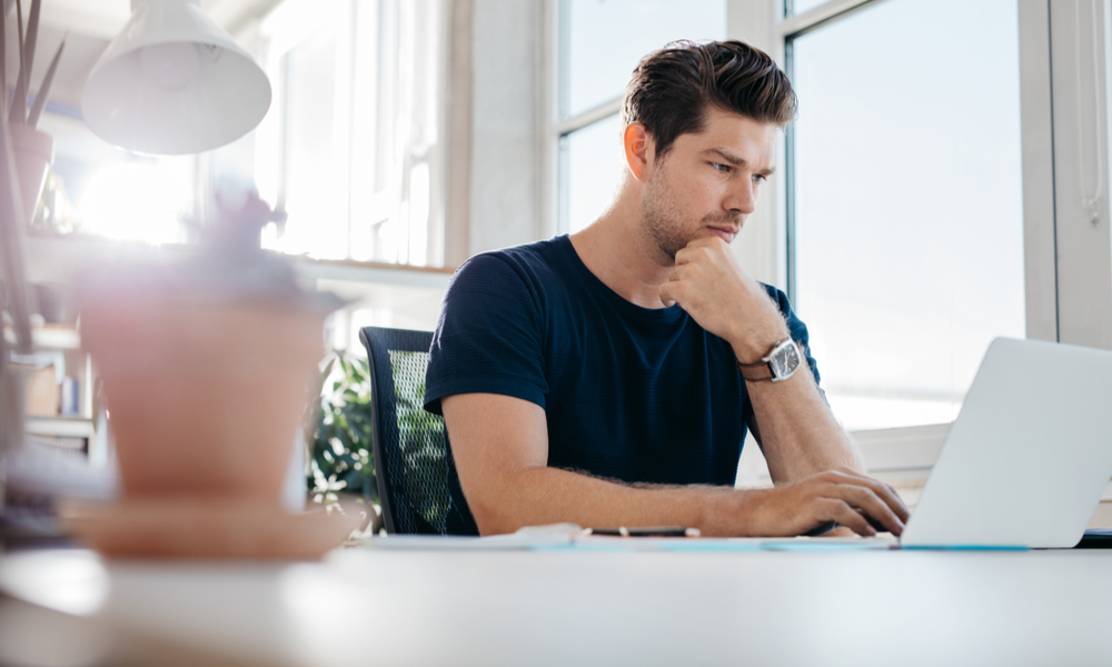  young man using laptop