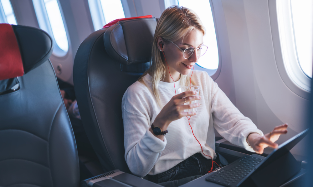 Girl On Laptop Flight