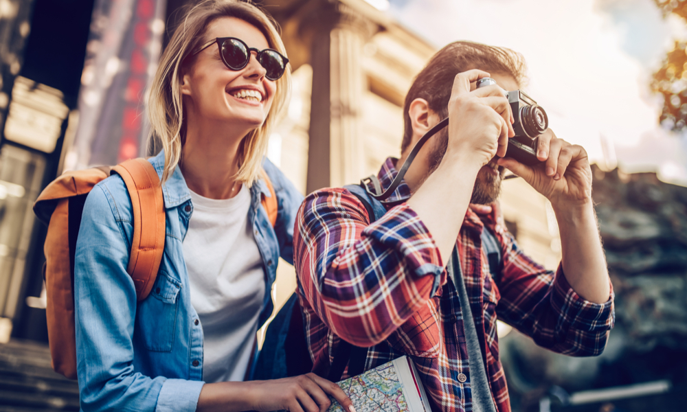 how to beat jet lag on international flights: Couple of tourists is exploring new city together.