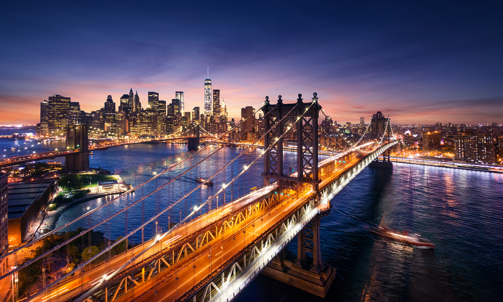 New York City - beautiful sunset over manhattan with manhattan and brooklyn bridge