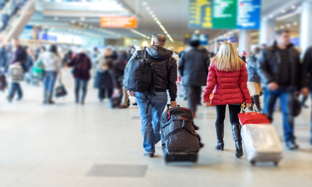 crowded airport around the holidays - one of the top winter flying mistakes