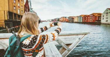 Woman taking photos in photogenic destinations