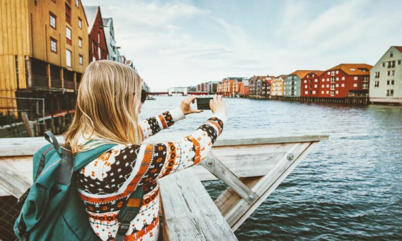 Woman taking photos in photogenic destinations