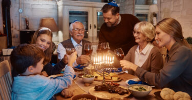 Family celebrating hanukkah