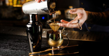 bartender serving fancy cocktail