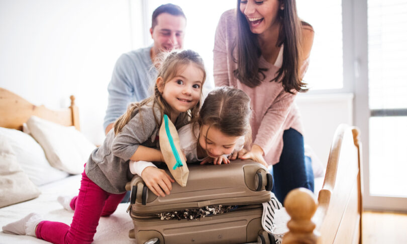 Family packing luggage