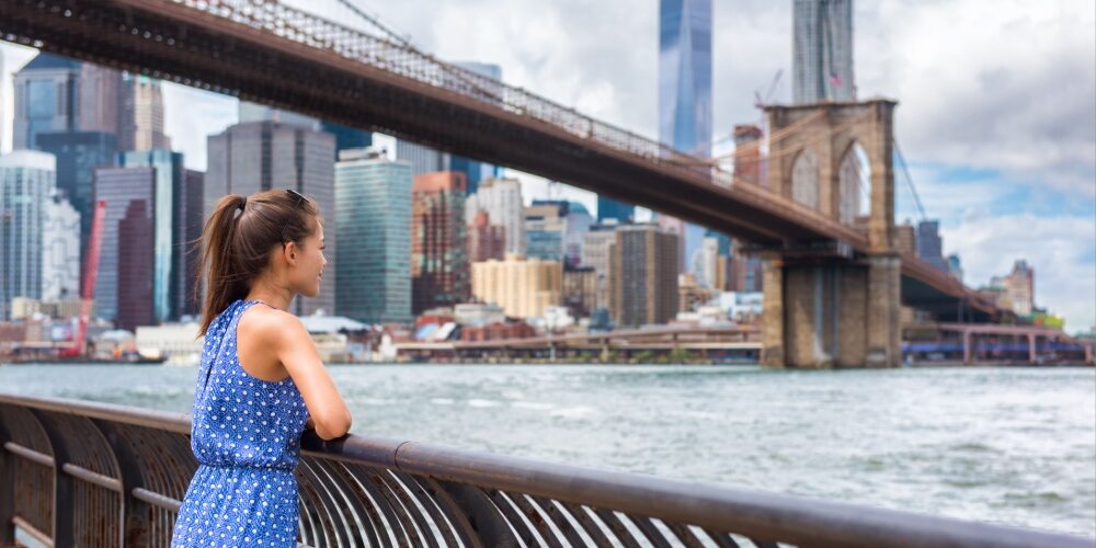 Girl admiring Manhattan from Brooklyn