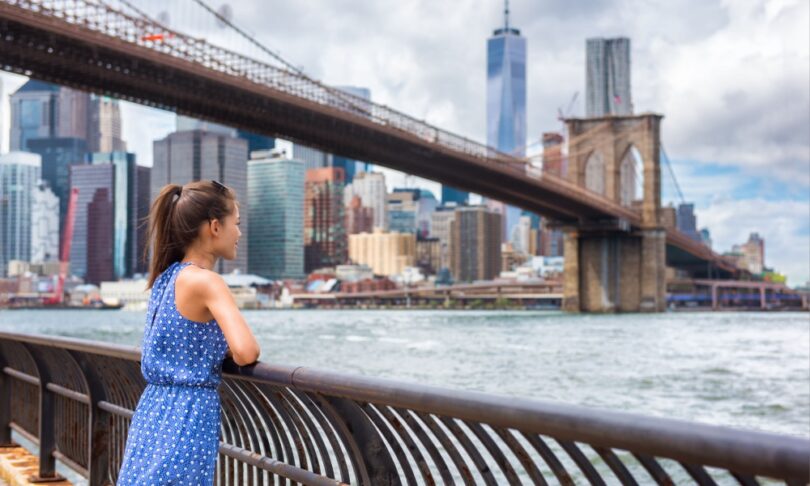 Girl admiring Manhattan from Brooklyn