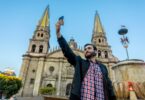 Tourist taking a selfie with his cell phone in the Cathedral in the city of Guadalajara