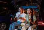 girls enjoying a movie outdoors