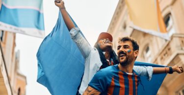 Couple celebrating team's victory