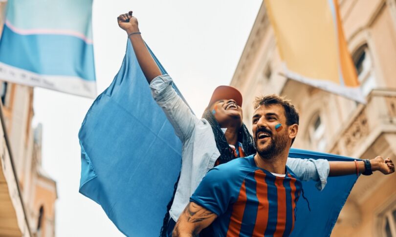 Couple celebrating team's victory